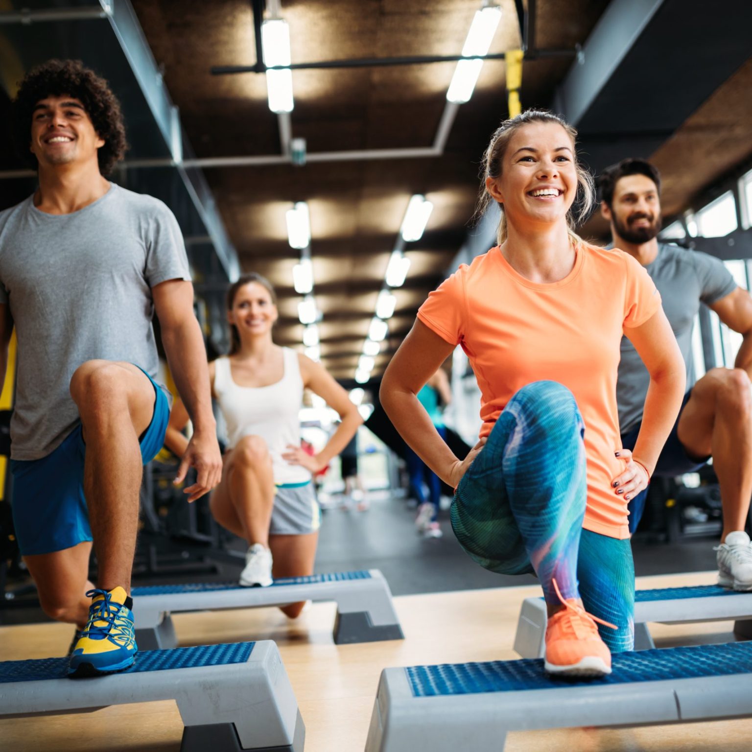 Group,Of,Young,People,Doing,Exercises,In,Gym